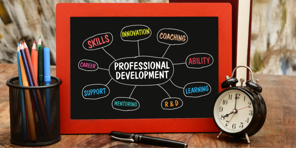 Image of a small blackboard with a red frame with an idea map of professional development.
